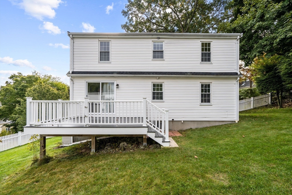 29 Walnut Terrace Arlington, MA 02476 - Photo 37 of 41 a view of a house with a deck and a yard
