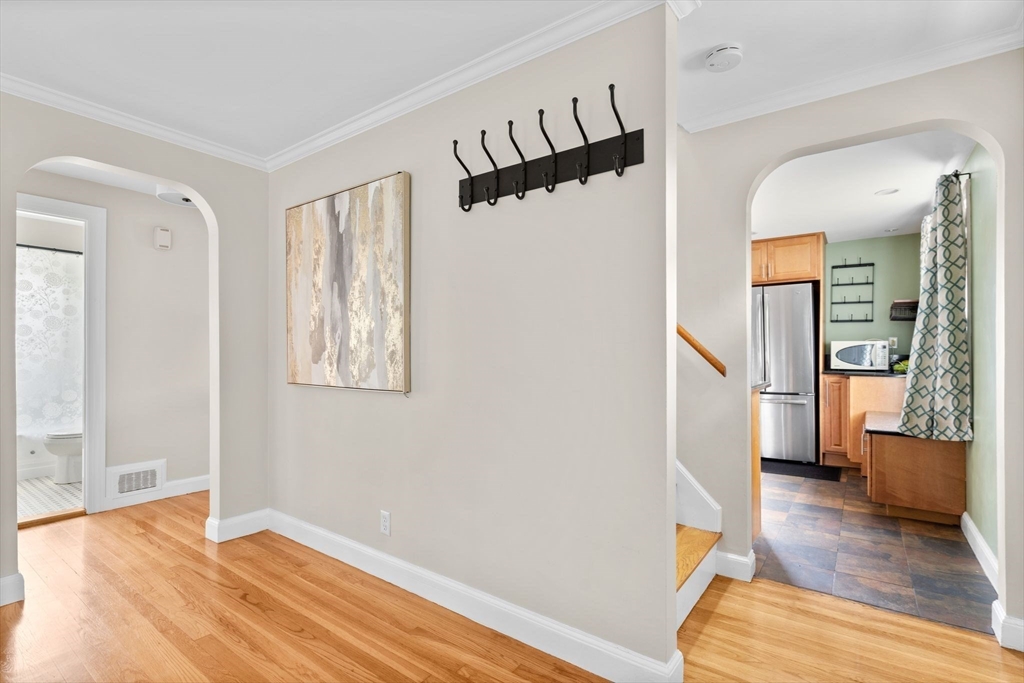 29 Walnut Terrace Arlington, MA 02476 - Photo 8 of 41 a view of a bedroom with wooden floor and a ceiling fan