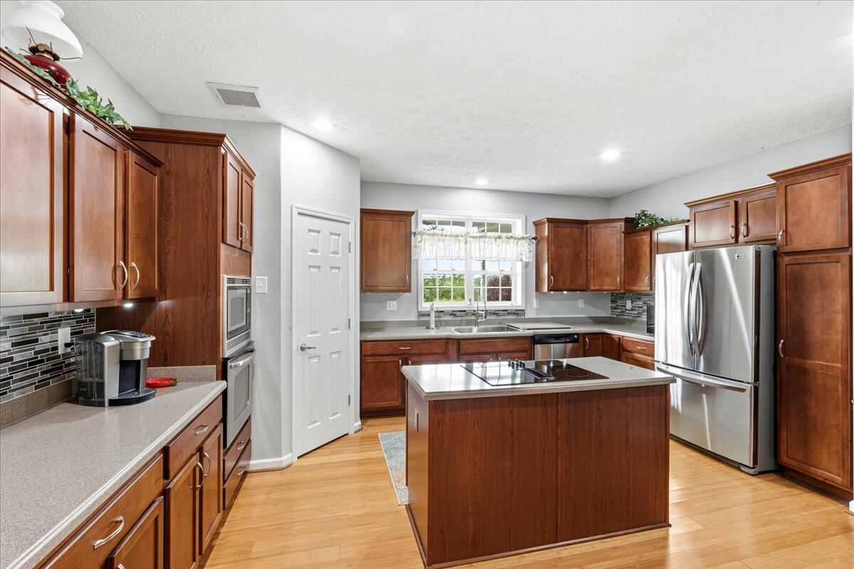 218 Mt Moriah Road Eagle Rock, VA 24085 - Photo 14 of 38 a kitchen with stainless steel appliances granite countertop a refrigerator and a stove