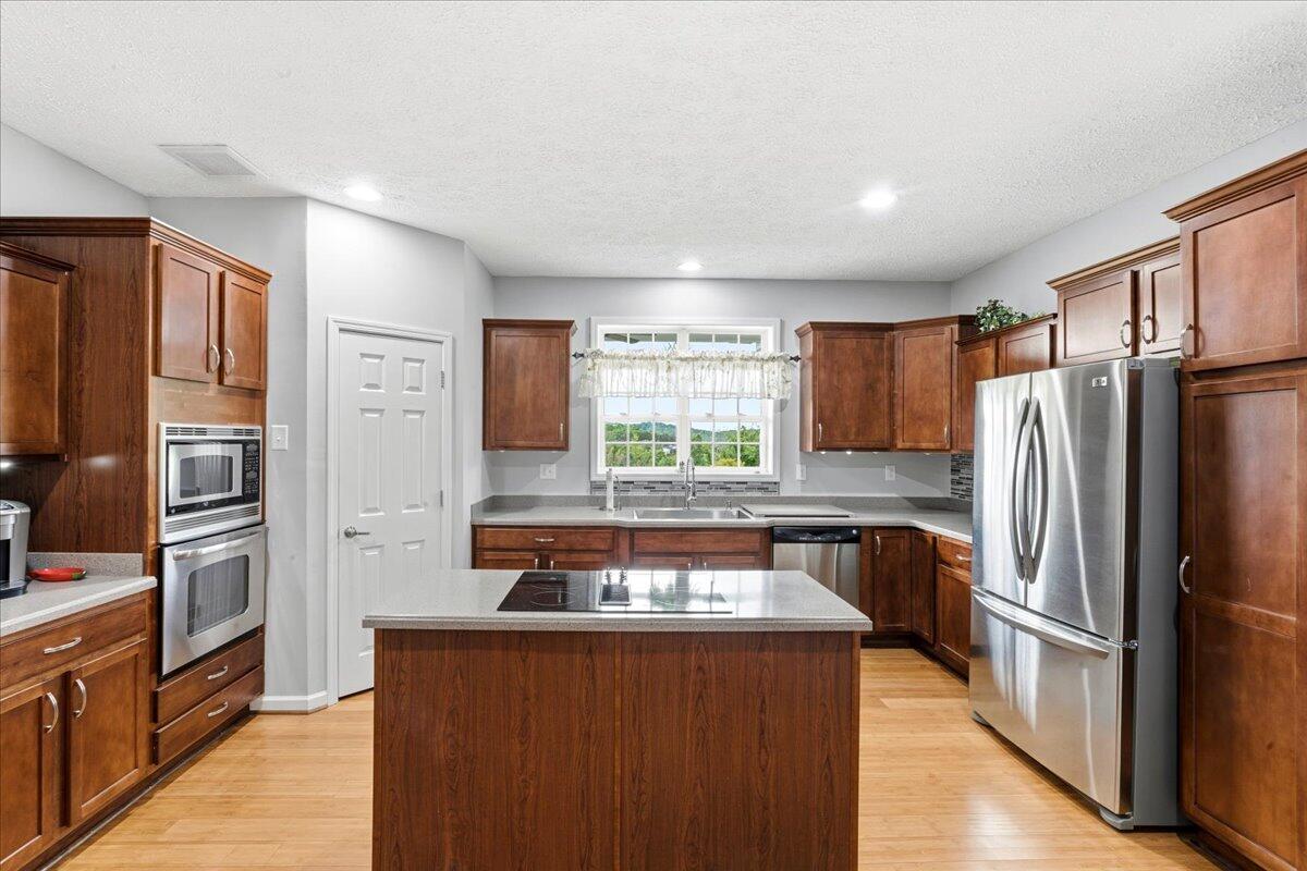 218 Mt Moriah Road Eagle Rock, VA 24085 - Photo 15 of 38 a kitchen with stainless steel appliances granite countertop a refrigerator and a stove