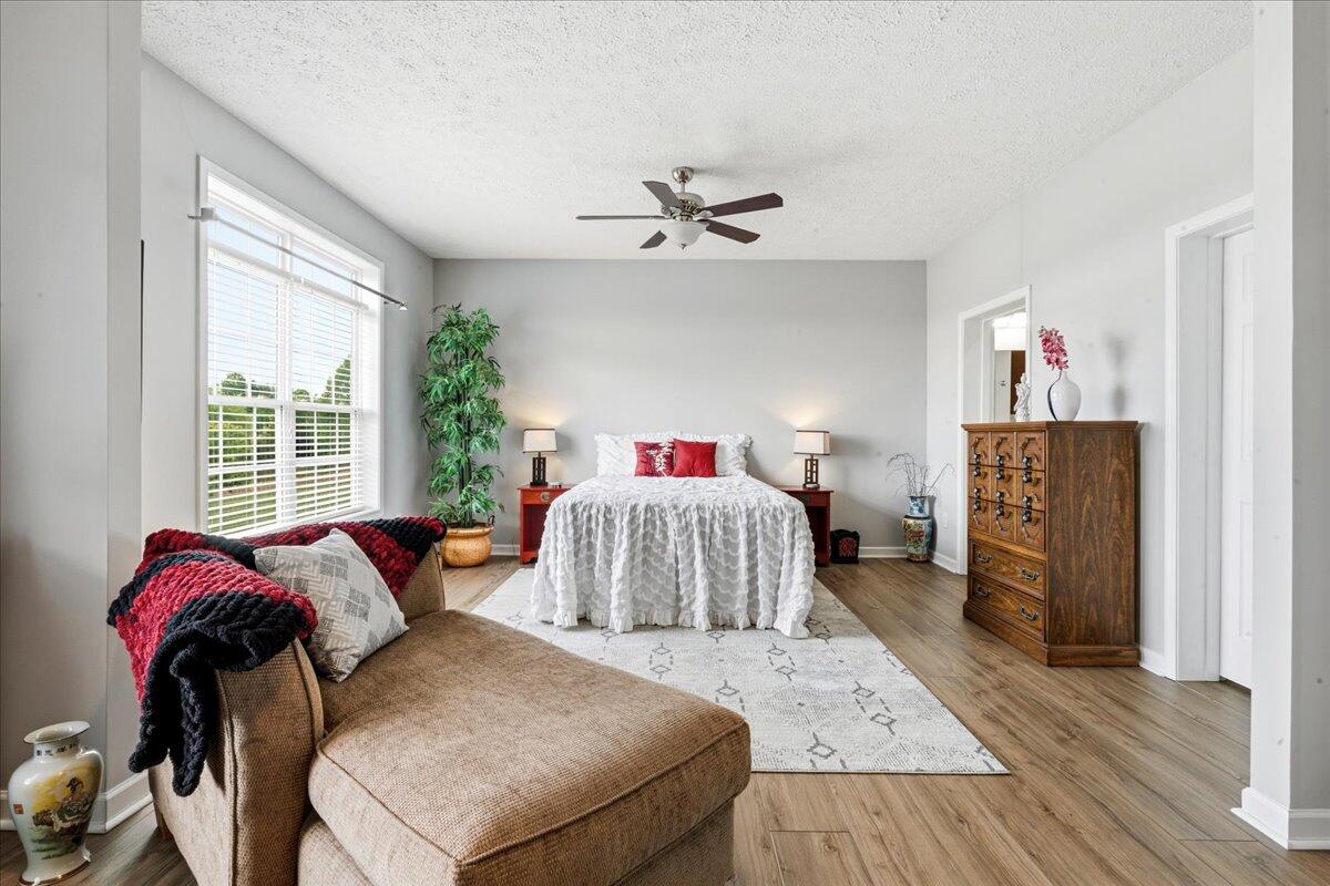 218 Mt Moriah Road Eagle Rock, VA 24085 - Photo 18 of 38 a bedroom with a bed and wooden floor