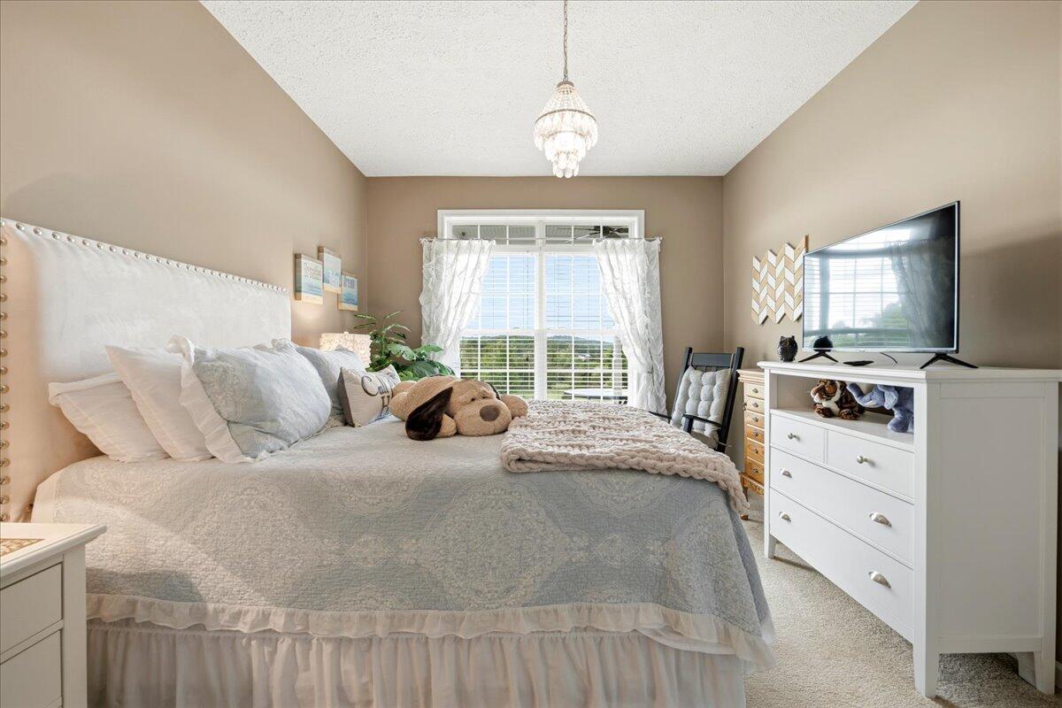218 Mt Moriah Road Eagle Rock, VA 24085 - Photo 24 of 38 a large bed sitting in a bedroom next to a window