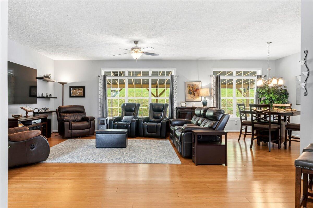 218 Mt Moriah Road Eagle Rock, VA 24085 - Photo 9 of 38 a living room with furniture wooden floor and a large window