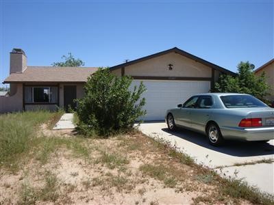 15483 Wichita Road Apple Valley, CA 92307 - Photo 1 of 1 a house view with a outdoor space