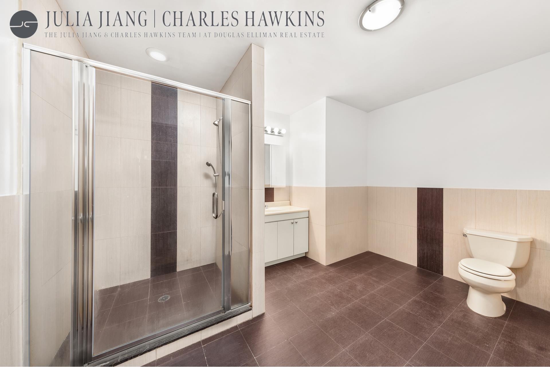 315 West 36th Street, Unit 12B Manhattan, NY 10018 - Photo 9 of 33 a bathroom with a toilet and a shower