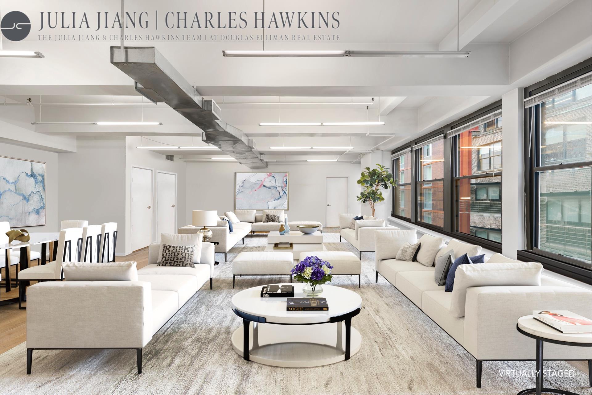 315 West 36th Street, Unit 12B Manhattan, NY 10018 - Photo 21 of 33 a living room with furniture and a large window