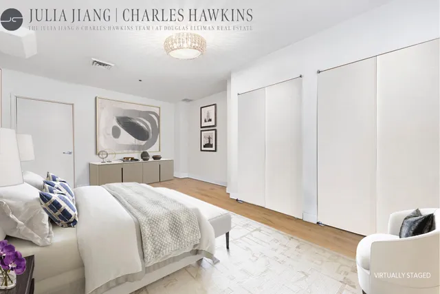 a bedroom with a bed and a cabinets