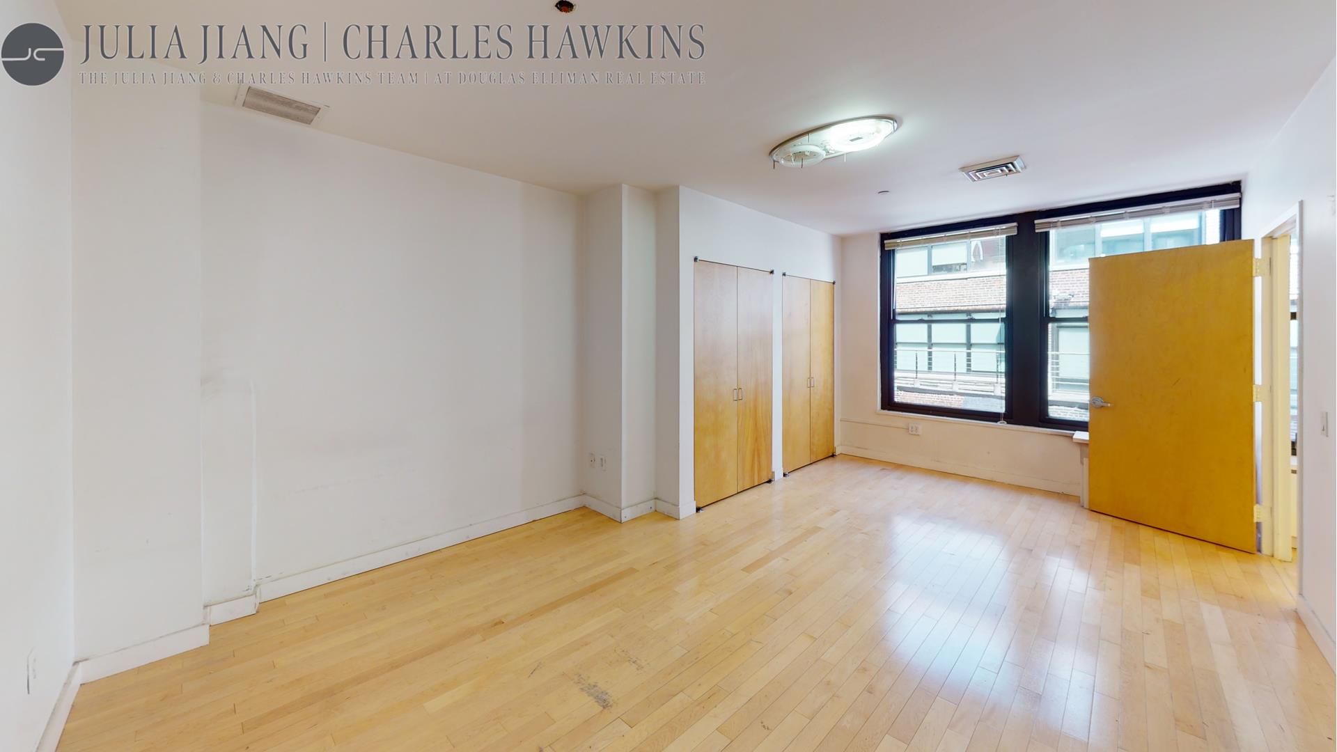 315 West 36th Street, Unit 12B Manhattan, NY 10018 - Photo 28 of 33 a view of an empty room with a window
