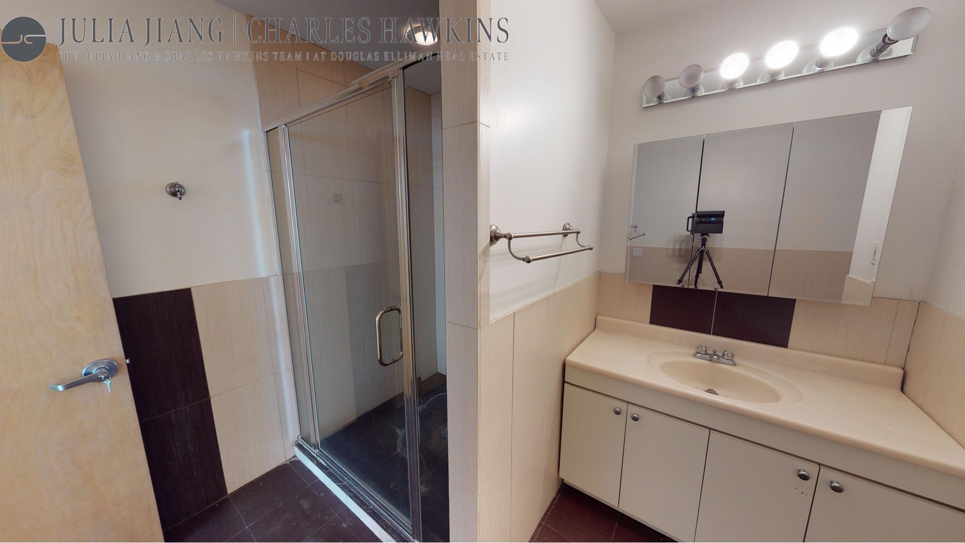 315 West 36th Street, Unit 12B Manhattan, NY 10018 - Photo 30 of 33 a bathroom with a sink a toilet and shower