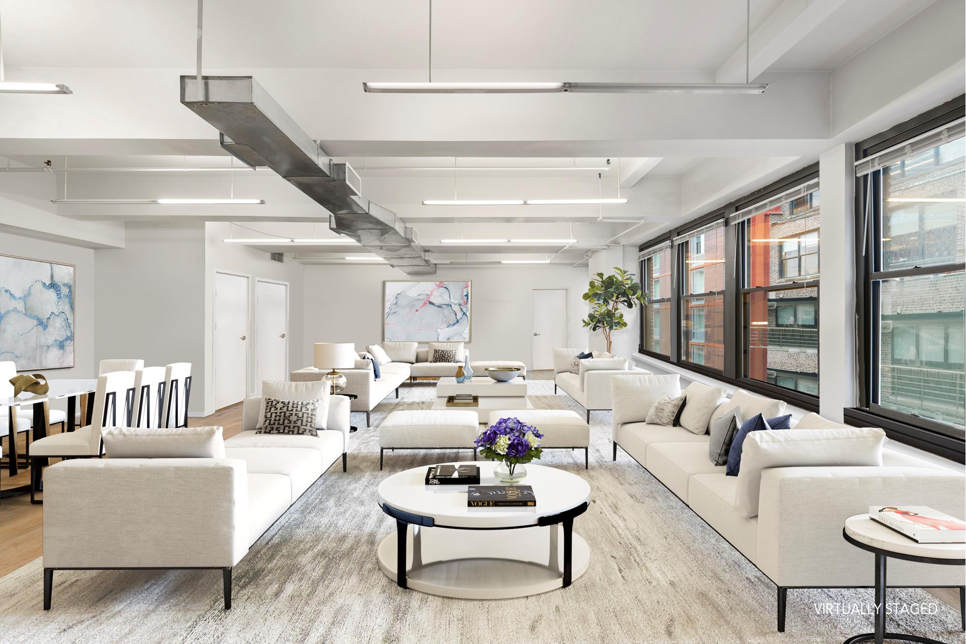 315 West 36th Street, Unit 12B Manhattan, NY 10018 - Photo 3 of 33 a living room with furniture and a large window