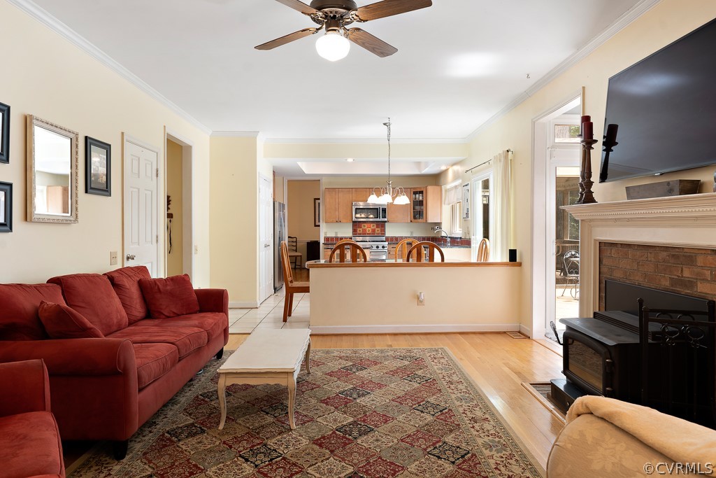 13903 Eastbluff Road Midlothian, VA 23112 - Photo 17 of 45 a living room with furniture kitchen view and a fireplace