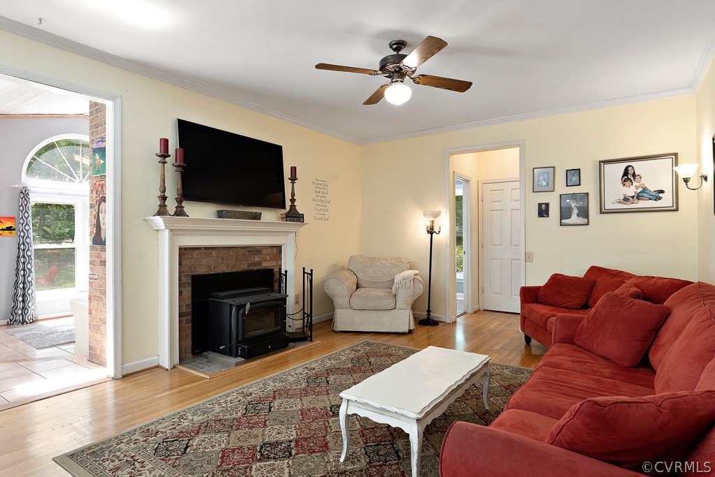 13903 Eastbluff Road Midlothian, VA 23112 - Photo 18 of 45 a living room with furniture a fireplace and a flat screen tv