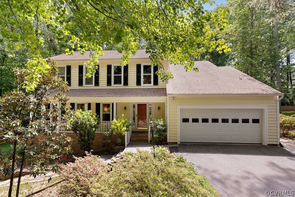13903 Eastbluff Road Midlothian, VA 23112 - Photo 2 of 45 a view of a white house with large windows and a large tree