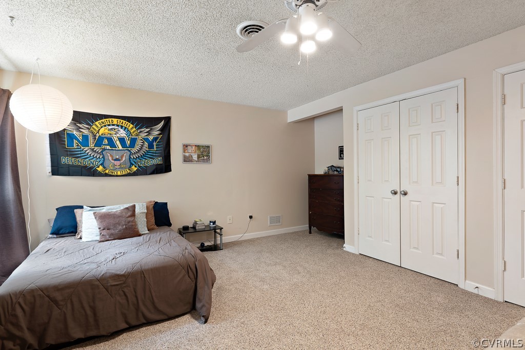 13903 Eastbluff Road Midlothian, VA 23112 - Photo 25 of 45 a bedroom with a bed and painting on the wall