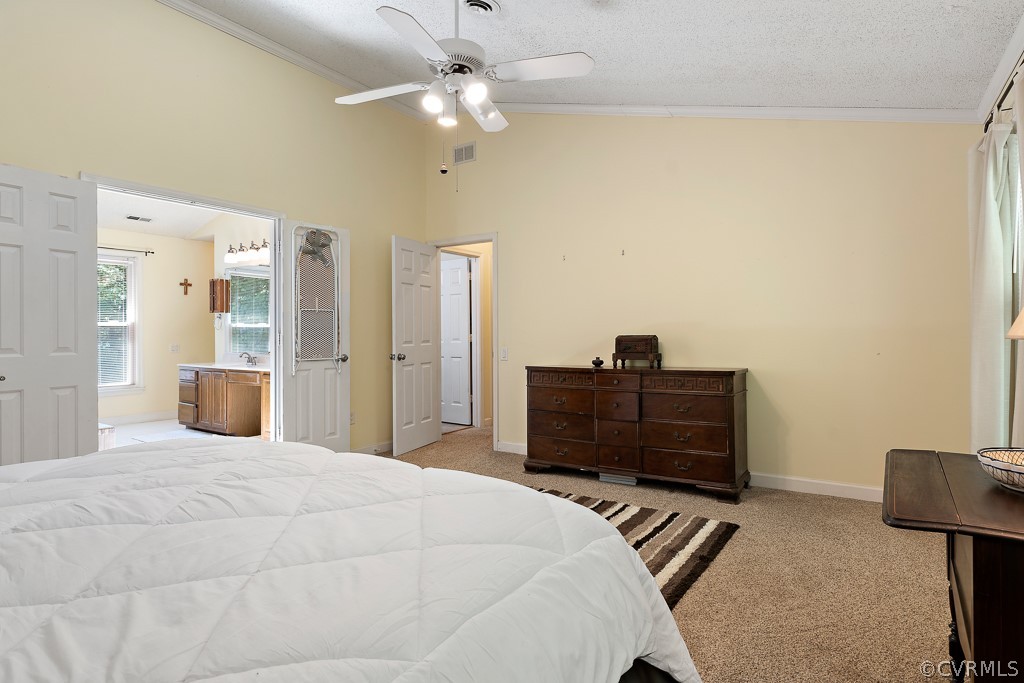 13903 Eastbluff Road Midlothian, VA 23112 - Photo 30 of 45 a bedroom with a bed and a chandelier