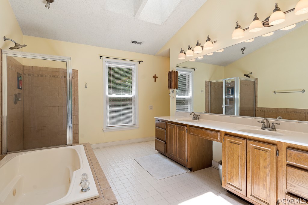 13903 Eastbluff Road Midlothian, VA 23112 - Photo 31 of 45 a spacious bathroom with a tub sink and mirror