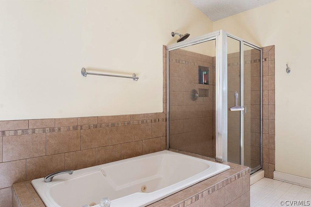 13903 Eastbluff Road Midlothian, VA 23112 - Photo 32 of 45 a bathroom with a tub and shower