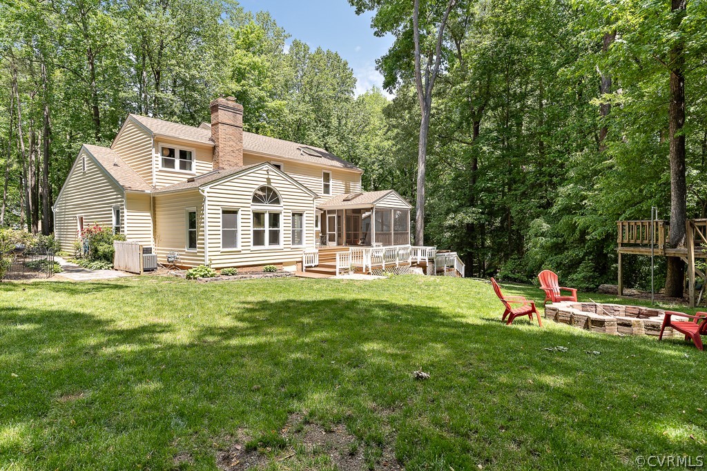 13903 Eastbluff Road Midlothian, VA 23112 - Photo 44 of 45 a front view of a house with a garden and trees