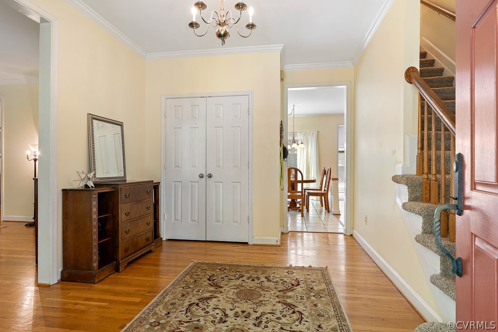 13903 Eastbluff Road Midlothian, VA 23112 - Photo 5 of 45 a view of a hallway with wooden floor and staircase