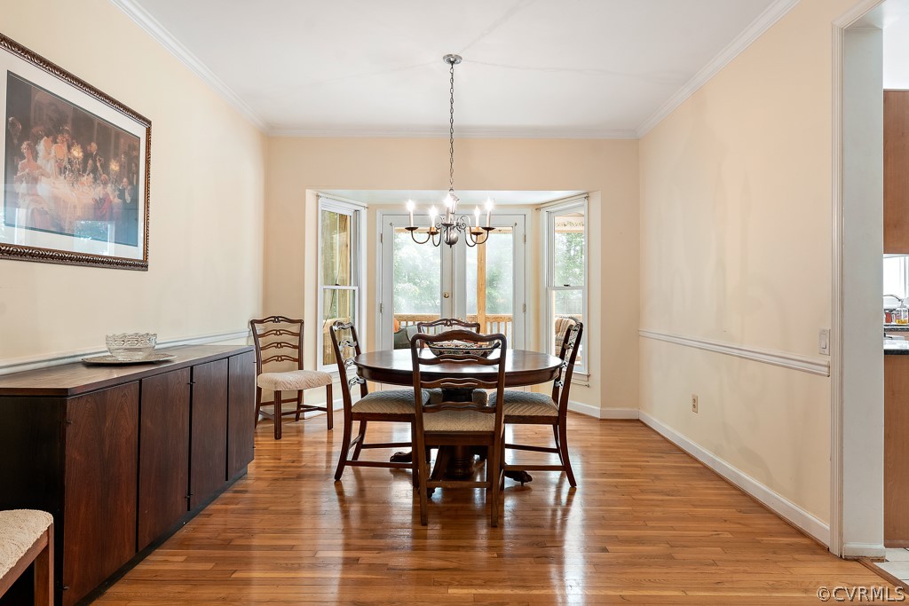 13903 Eastbluff Road Midlothian, VA 23112 - Photo 9 of 45 a dining room with furniture window and wooden floor