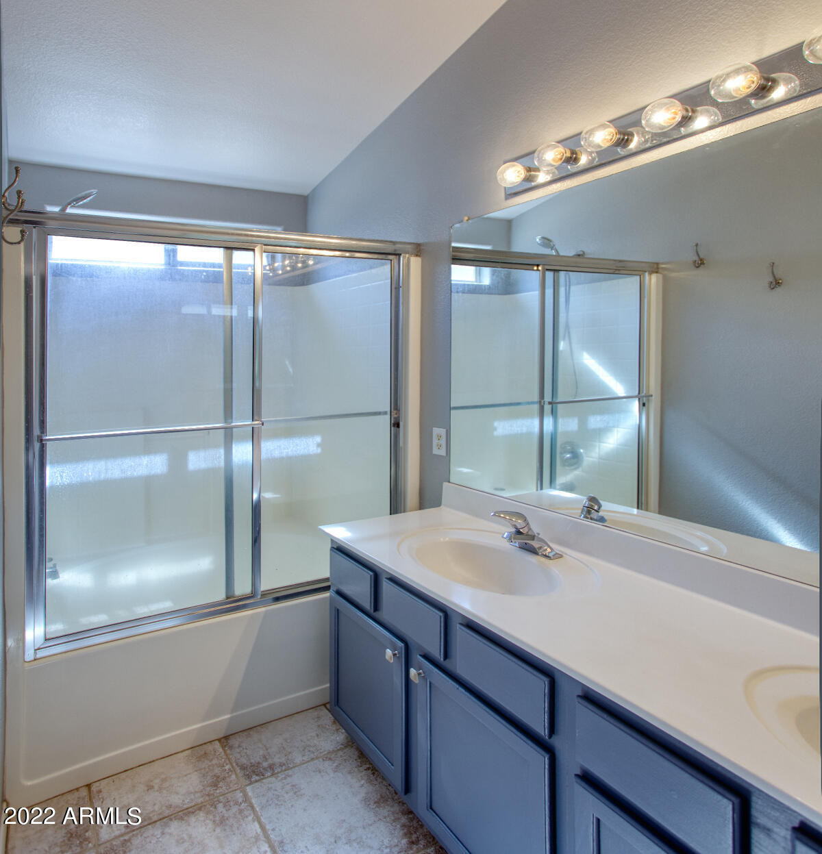 4333 South Rim Court Gilbert, AZ 85297 - Photo 11 of 20 a bathroom with a sink and mirror