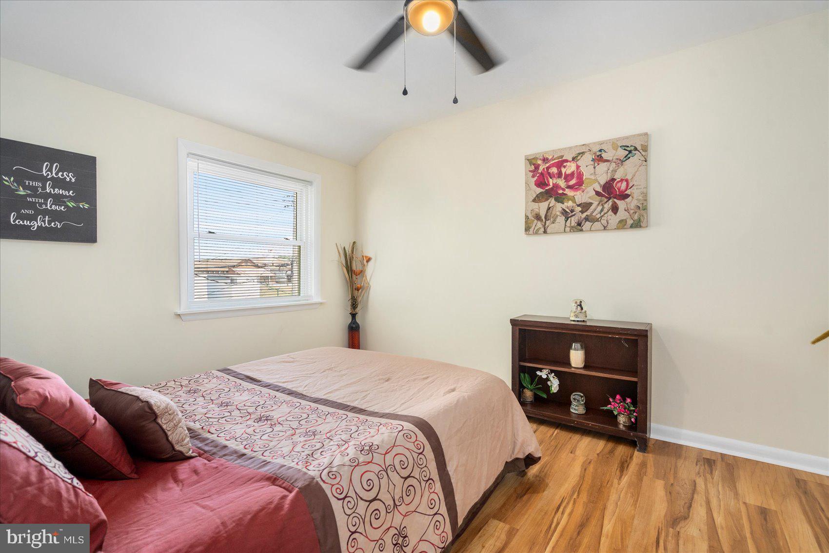 7932 Kavanagh Road Dundalk, MD 21222 - Photo 30 of 39 a bedroom with a bed and a workspace