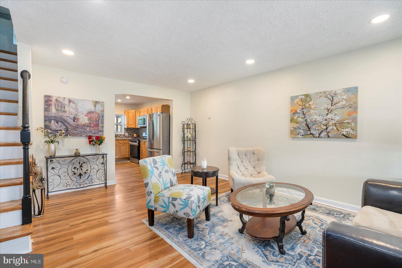 7932 Kavanagh Road Dundalk, MD 21222 - Photo 6 of 39 a living room with furniture and a toilet
