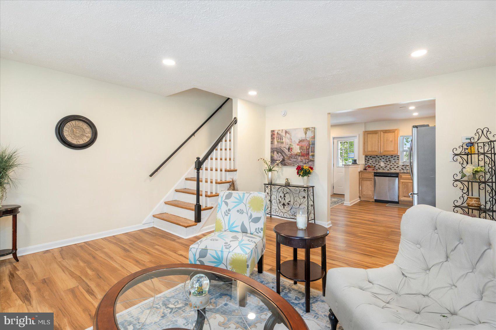 7932 Kavanagh Road Dundalk, MD 21222 - Photo 7 of 39 a living room with furniture and wooden floor