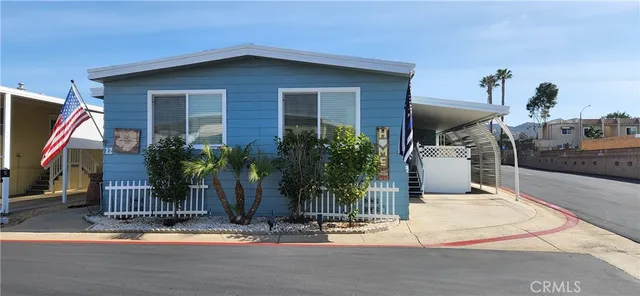 a view of house with outdoor space and porch