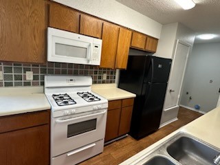 3603 Buffalo Springs Trail, Unit C Georgetown, TX 78628 - Photo 11 of 24 a kitchen with a stove microwave and refrigerator