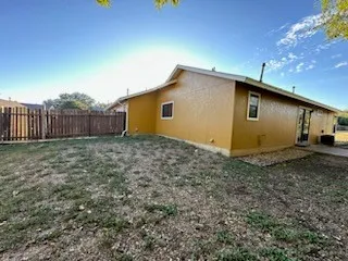 a view of a yard with a tree