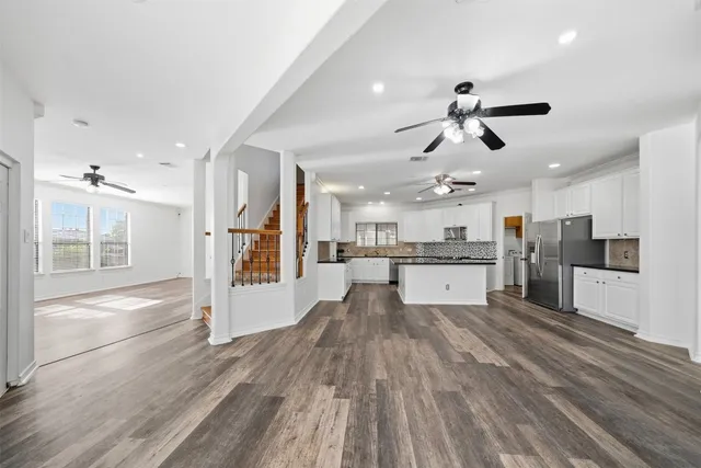 a view of a house with snow on the road