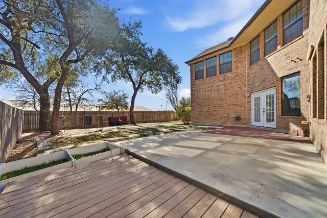 a view of a house with snow on the road