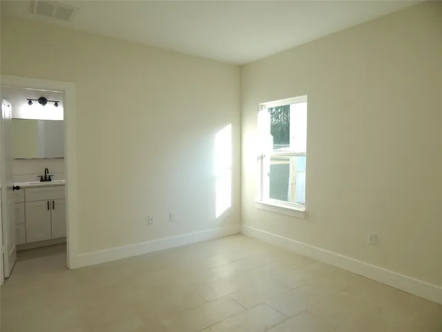 a view of an empty room with a window