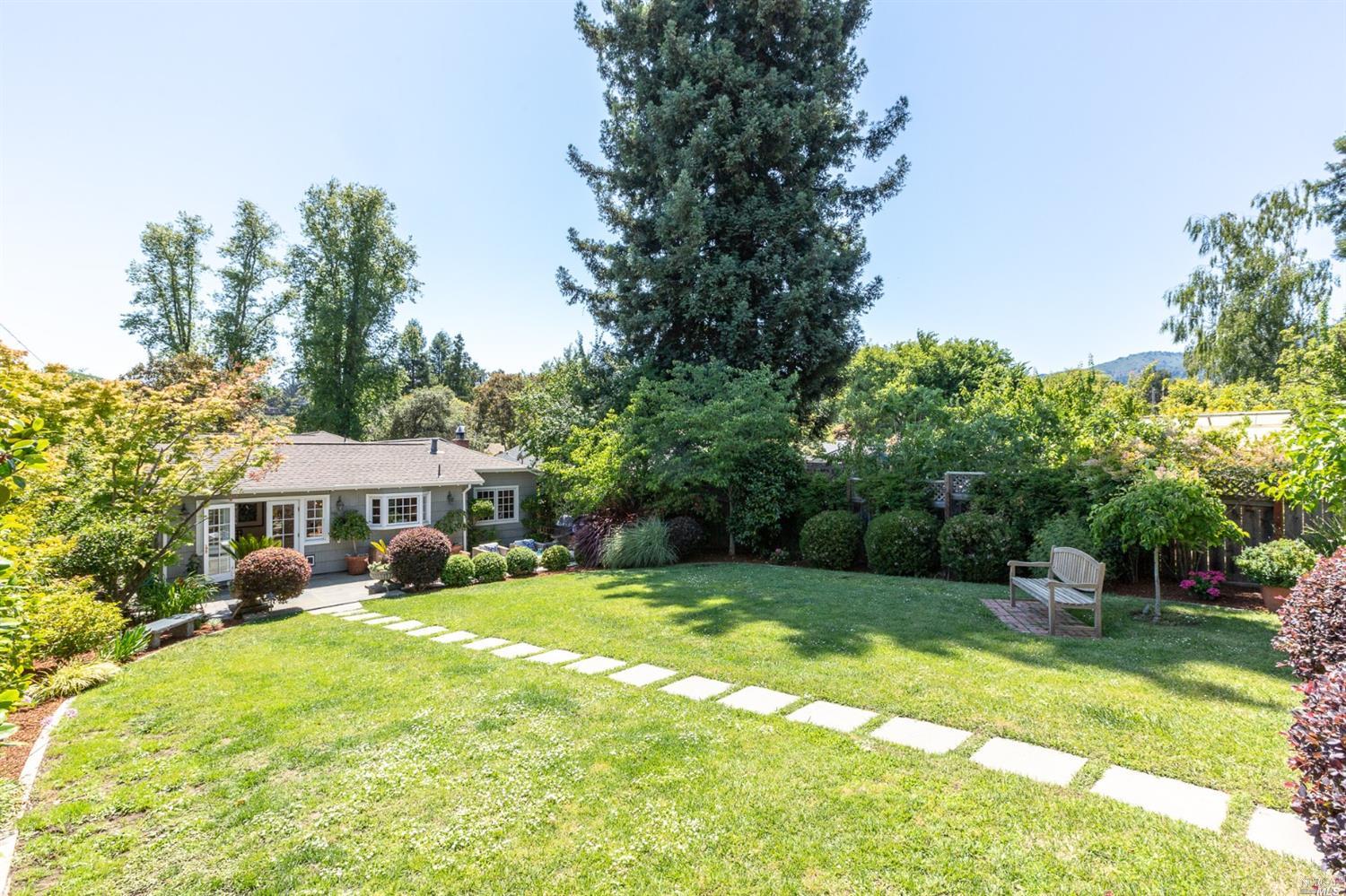 141 Locust Avenue Mill Valley, CA 94941 - Photo 1 of 1 a view of a house with a big yard and palm trees