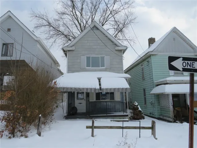 an empty room with wooden floor