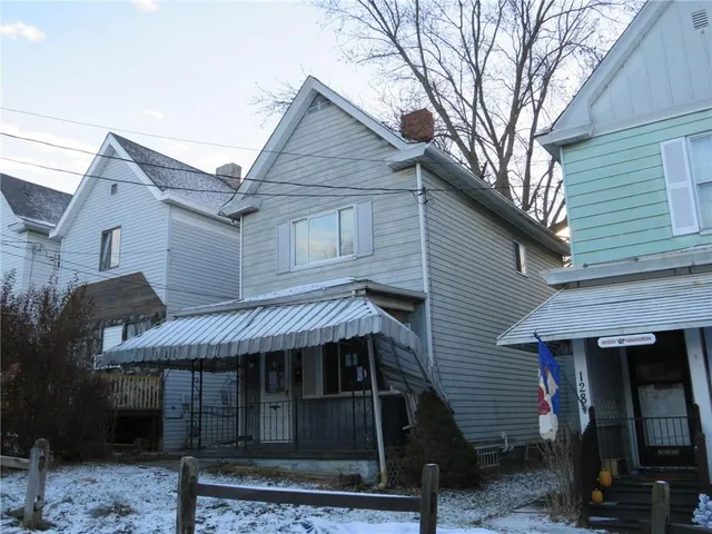 a front view of a house with garage