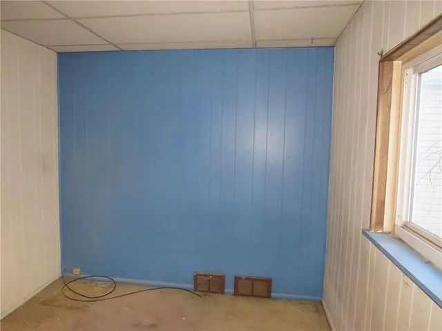 a view of a room with rack and a window