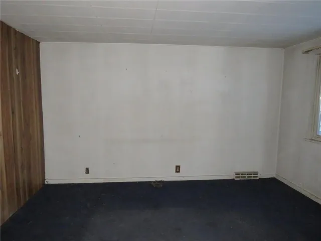 an empty room with wooden floor