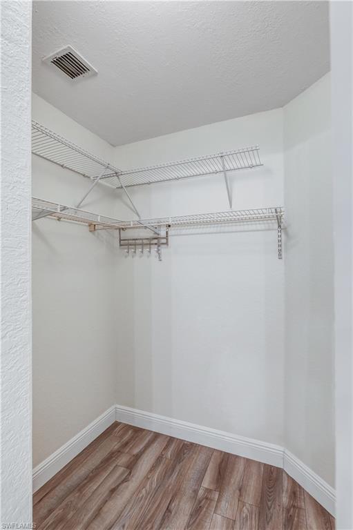 8285 Ibis Club Drive, Unit 807 Naples, FL 34104 - Photo 11 of 42 a view of a room with racks on the wall