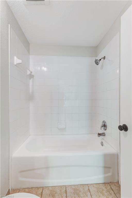 8285 Ibis Club Drive, Unit 807 Naples, FL 34104 - Photo 12 of 42 a bathroom with a bathtub