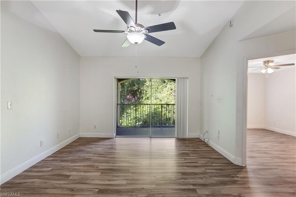 8285 Ibis Club Drive, Unit 807 Naples, FL 34104 - Photo 13 of 42 wooden floor in an empty room with a window