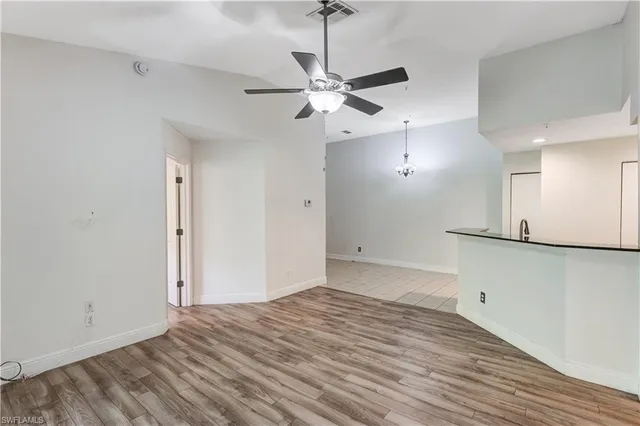 a view of a room with a ceiling fan