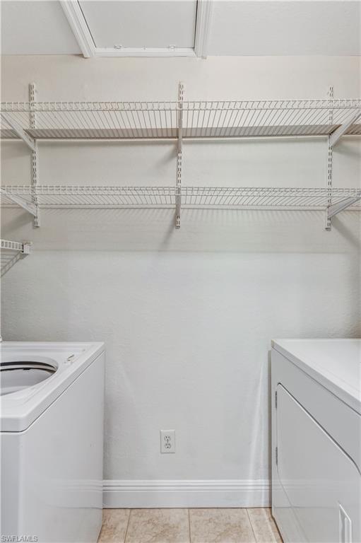 8285 Ibis Club Drive, Unit 807 Naples, FL 34104 - Photo 22 of 42 a utility room with dryer and washer