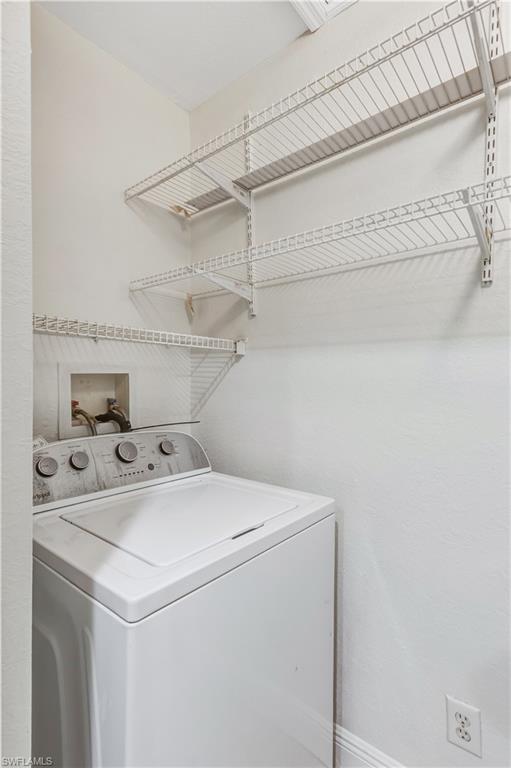 8285 Ibis Club Drive, Unit 807 Naples, FL 34104 - Photo 23 of 42 a utility room with dryer and washer