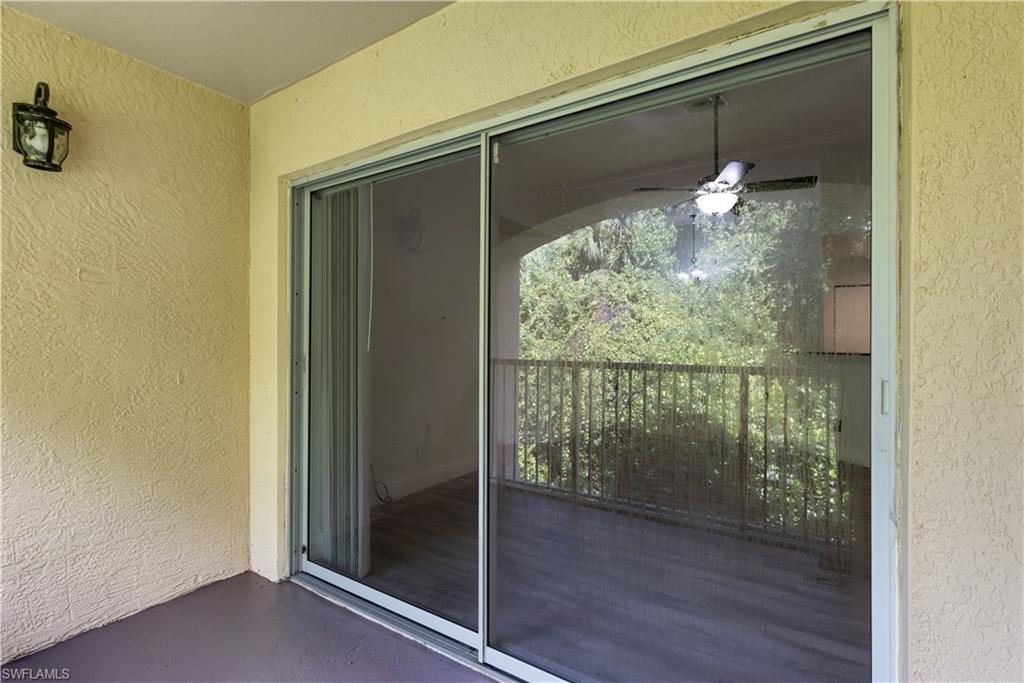 8285 Ibis Club Drive, Unit 807 Naples, FL 34104 - Photo 25 of 42 a view of a glass door and window