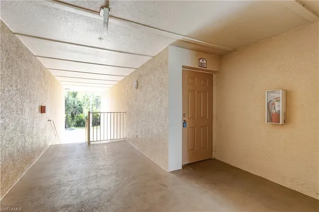 a front view of a house with a garden and yard