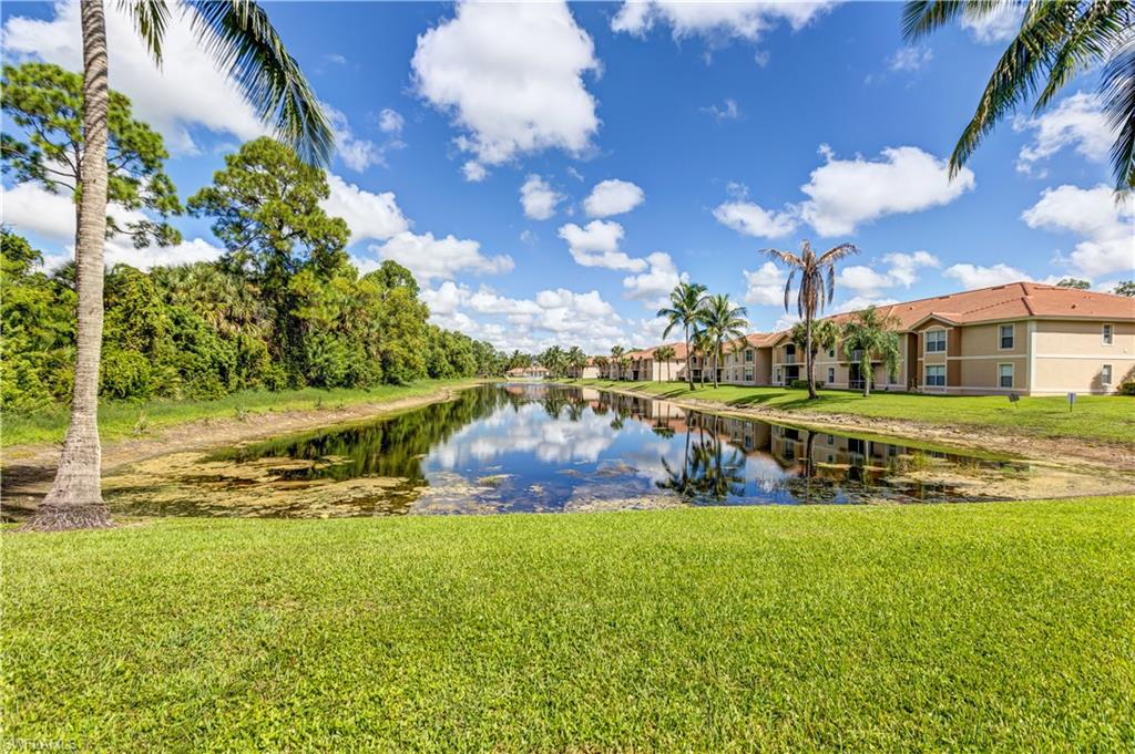 8285 Ibis Club Drive, Unit 807 Naples, FL 34104 - Photo 32 of 42 a view of a house with a big yard