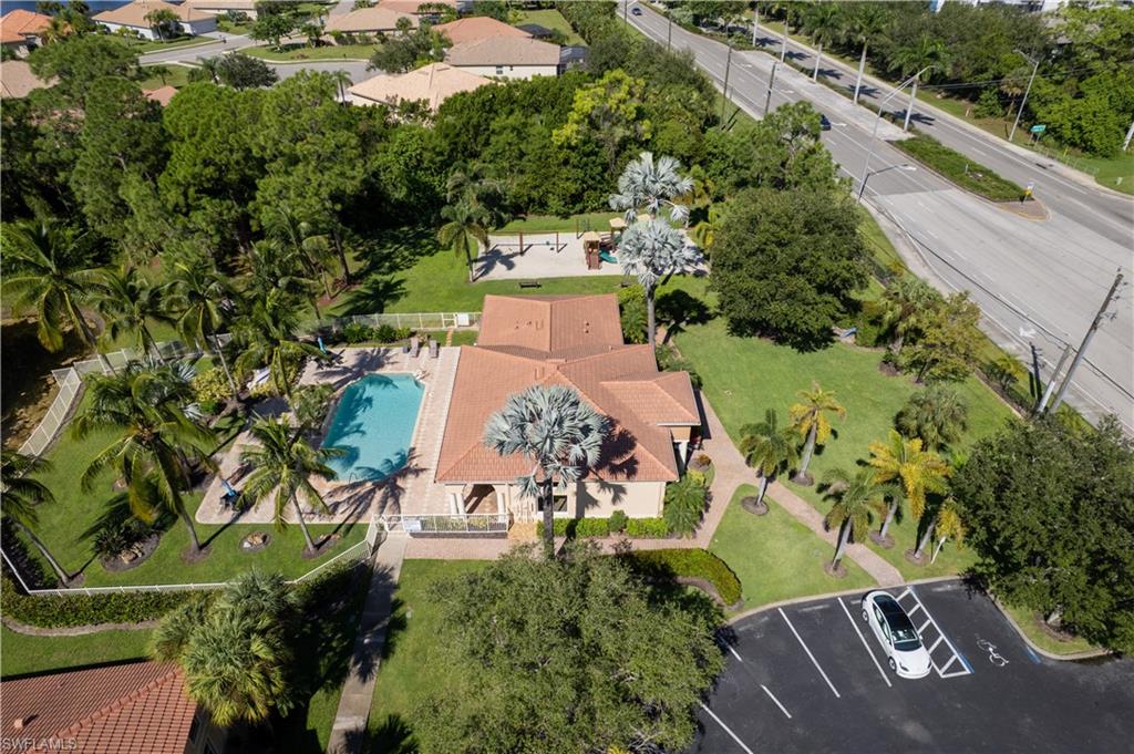 8285 Ibis Club Drive, Unit 807 Naples, FL 34104 - Photo 40 of 42 an aerial view of a house with a yard