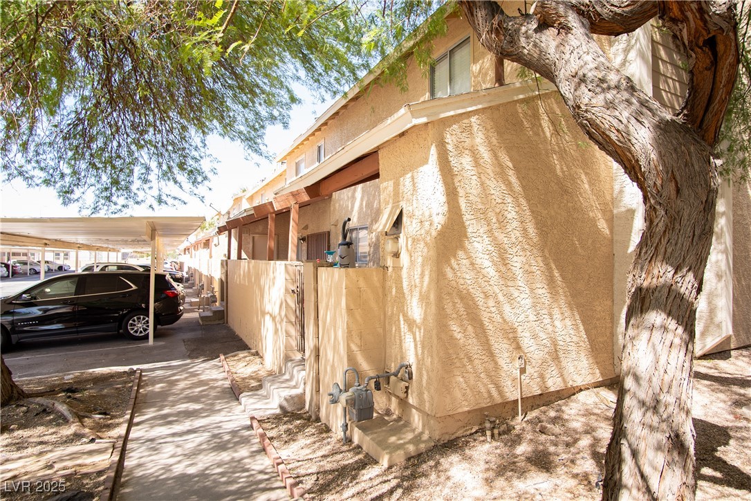 3844 Fitzpatrick Drive Las Vegas, NV 89115 - Photo 18 of 23 View of side of home featuring stucco siding
